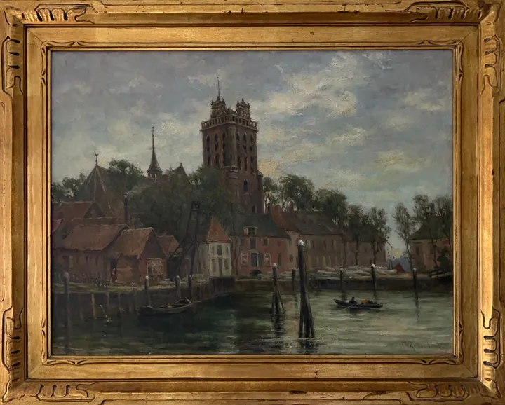Red-roofed houses and a tall church tower beside a harbor