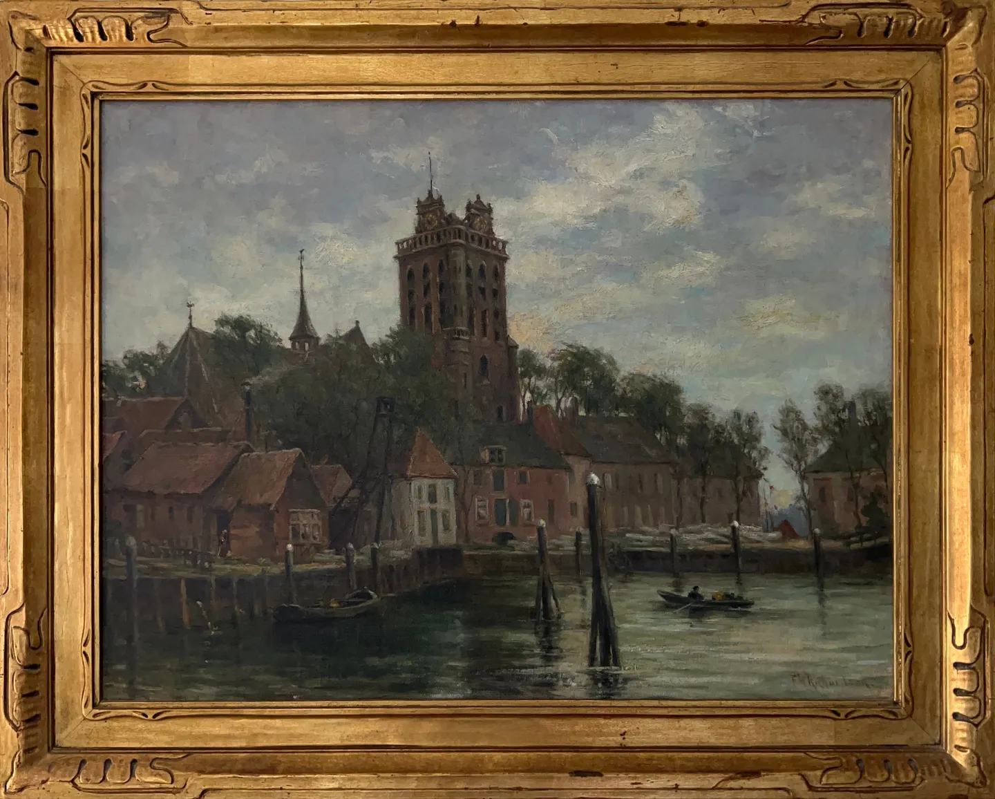 Red-roofed houses and a tall church tower beside a harbor