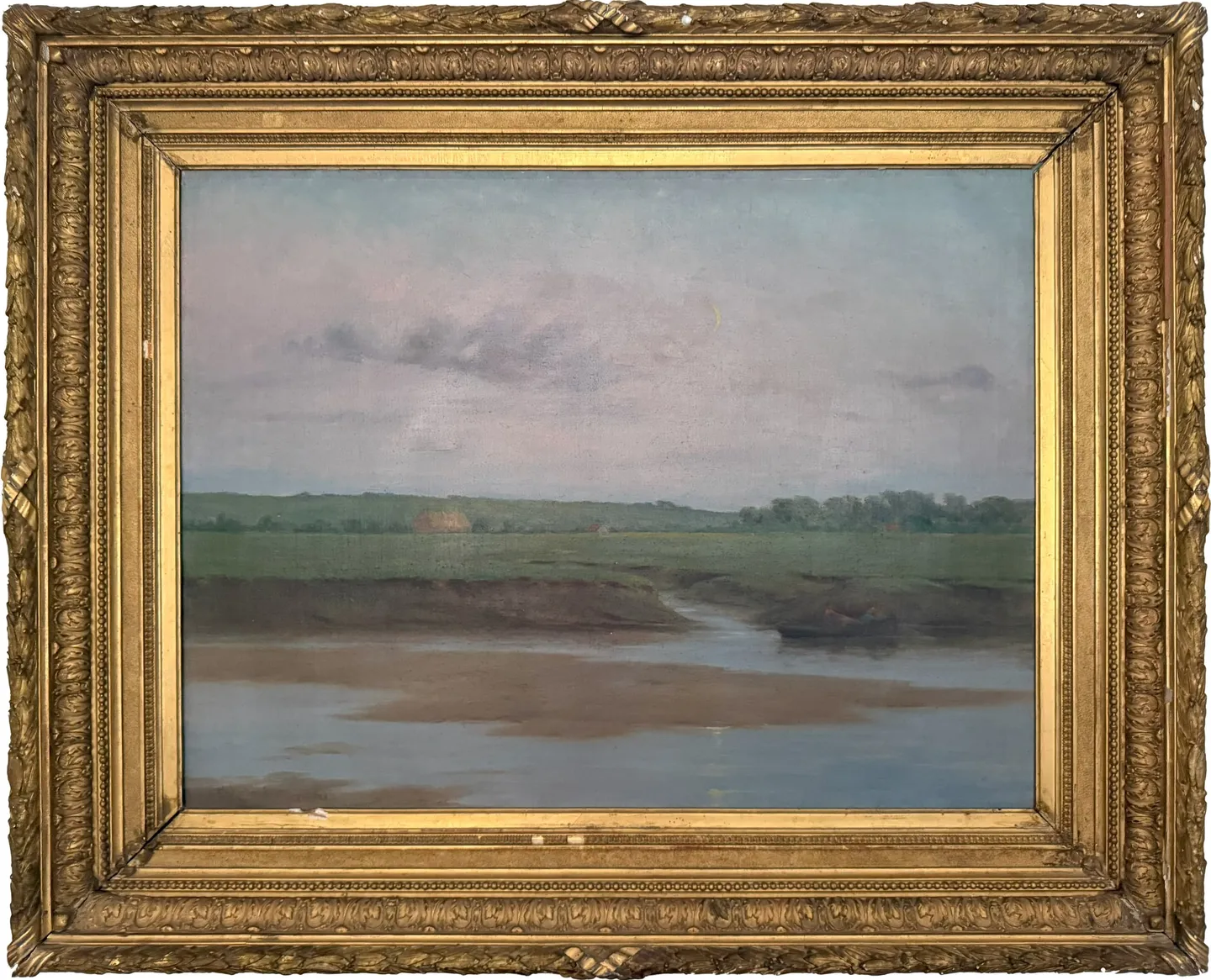 A tidal creek winding through flat green marsh under a pale evening sky
