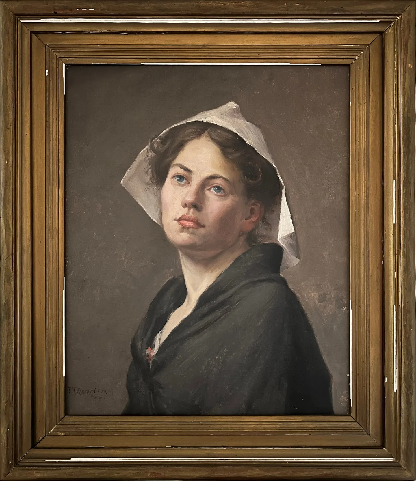 A young woman in a white coif and dark shawl, looking upward